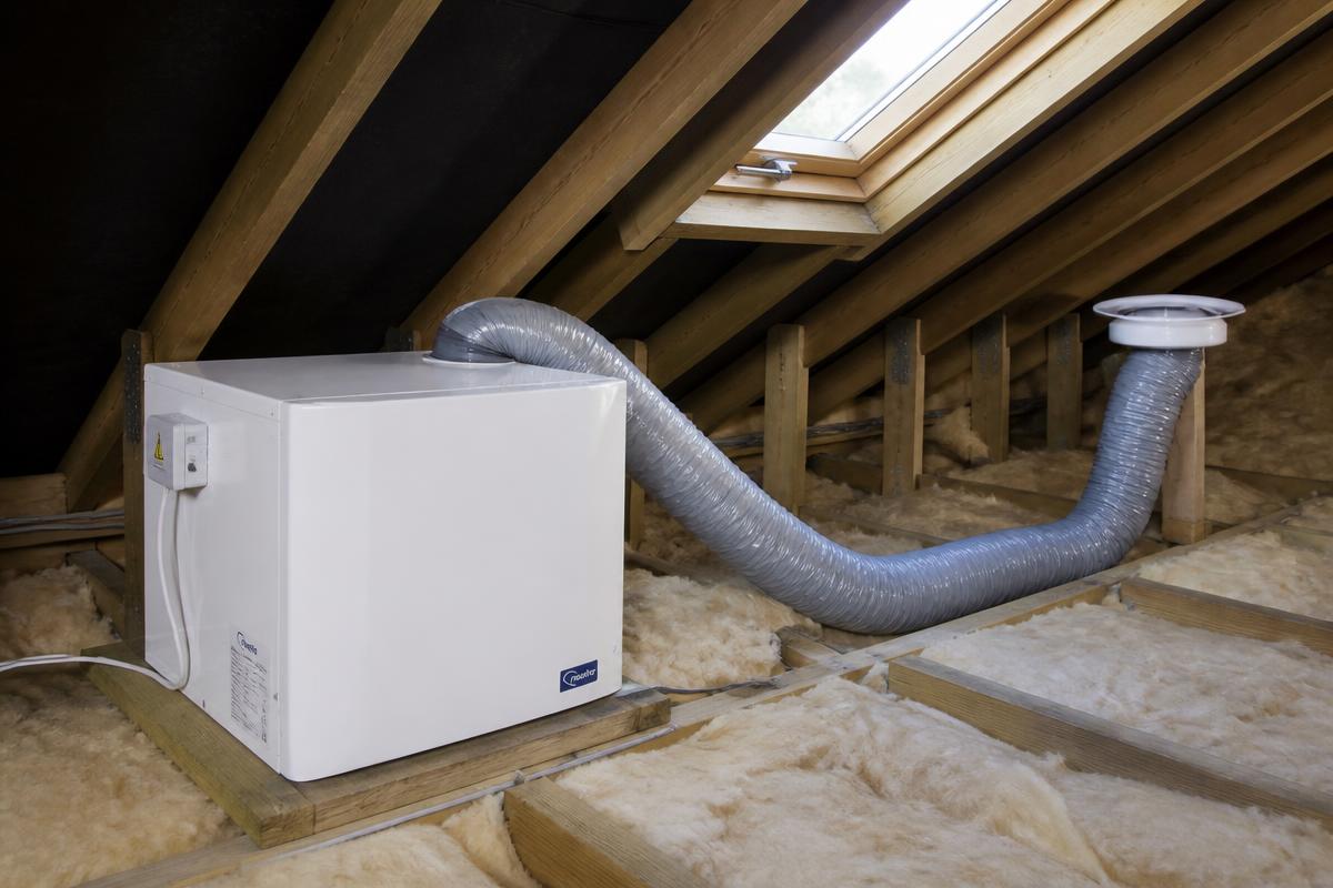 PIV positive input ventilation unit installed in a loft with ducting to a ceiling diffuser